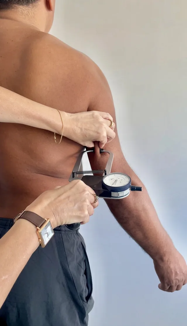 Measuring a skinfold with a skinfold caliper